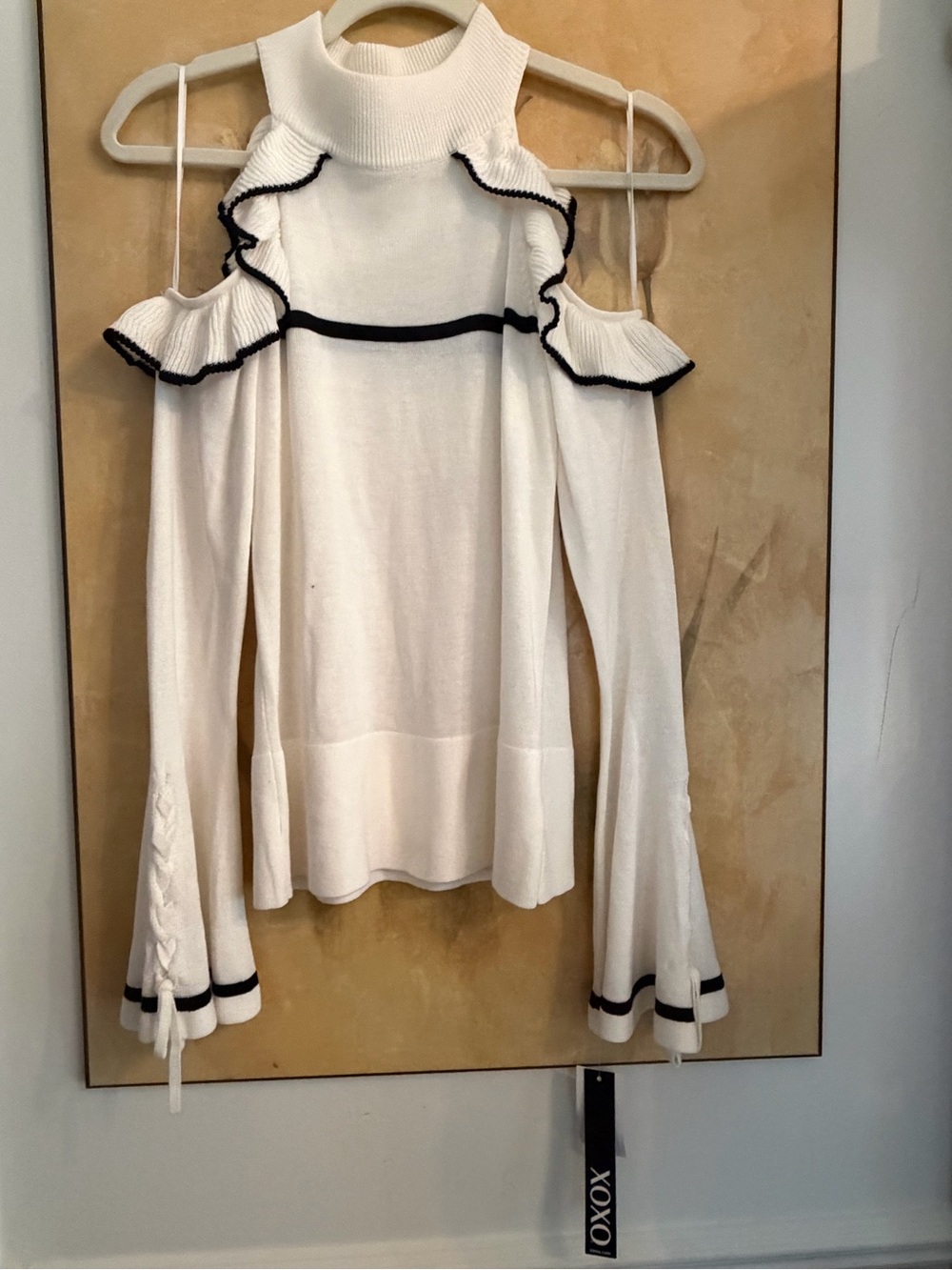 XOXO Cream Off-Shoulder Ruffle Sweater with Black Trim